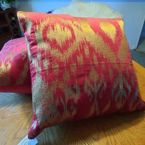 Two Calillo red and gold pillows
